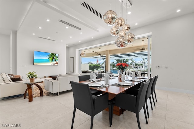 dining room with ceiling fan and light tile patterned flooring