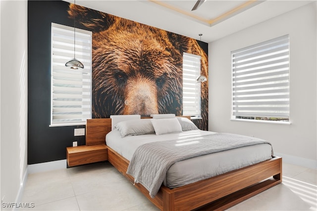 bedroom with light tile patterned floors and ceiling fan