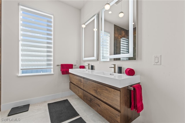 bathroom featuring tile patterned flooring, vanity, and a shower with shower door