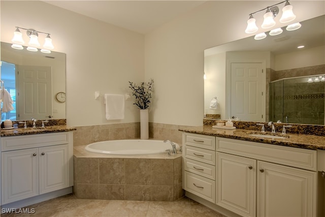 bathroom featuring tile patterned floors, vanity, and plus walk in shower