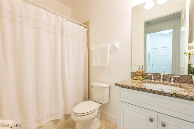 bathroom featuring tile patterned floors, curtained shower, vanity, and toilet