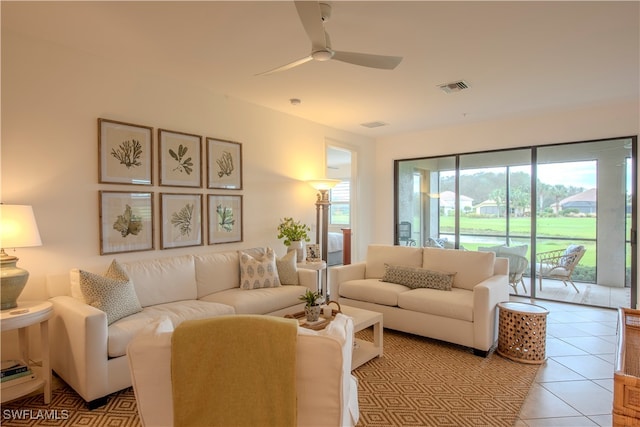 tiled living room featuring ceiling fan