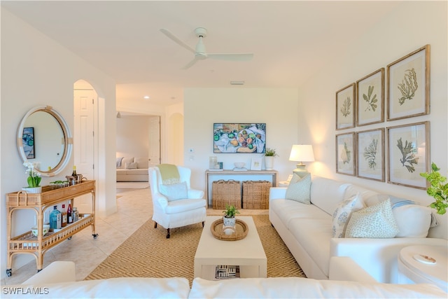 living room featuring ceiling fan and light tile patterned floors