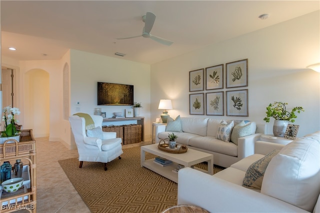 living room with ceiling fan and light tile patterned flooring