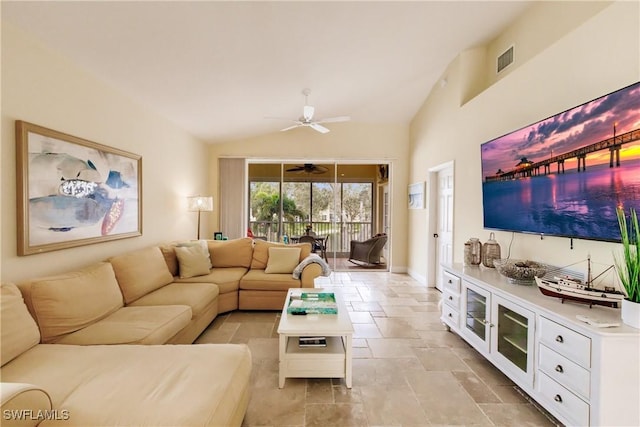 living room with ceiling fan and lofted ceiling