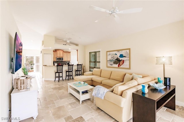 living room featuring ceiling fan