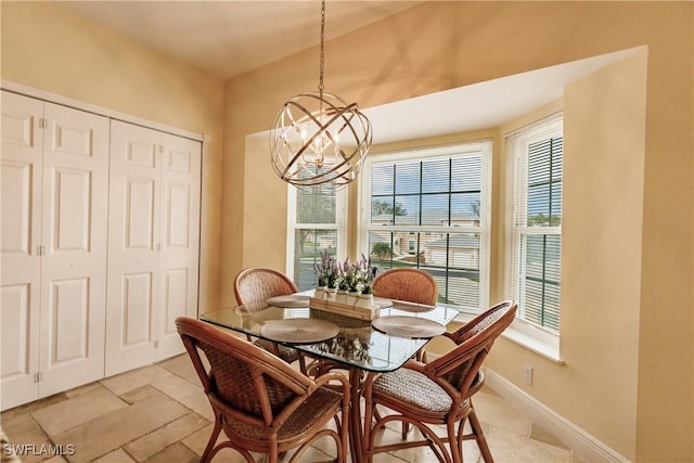 dining space with an inviting chandelier