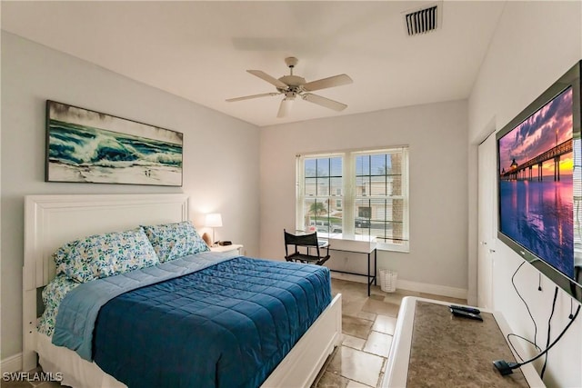 bedroom featuring ceiling fan and light tile patterned floors