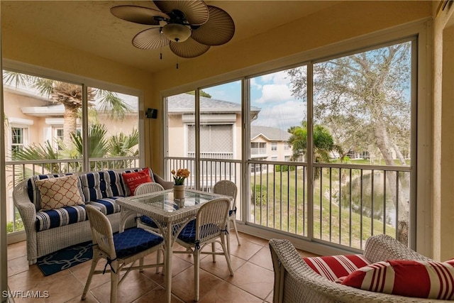 sunroom with plenty of natural light and ceiling fan