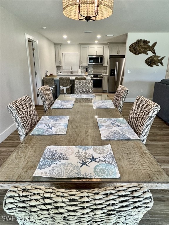 dining room with dark wood-type flooring