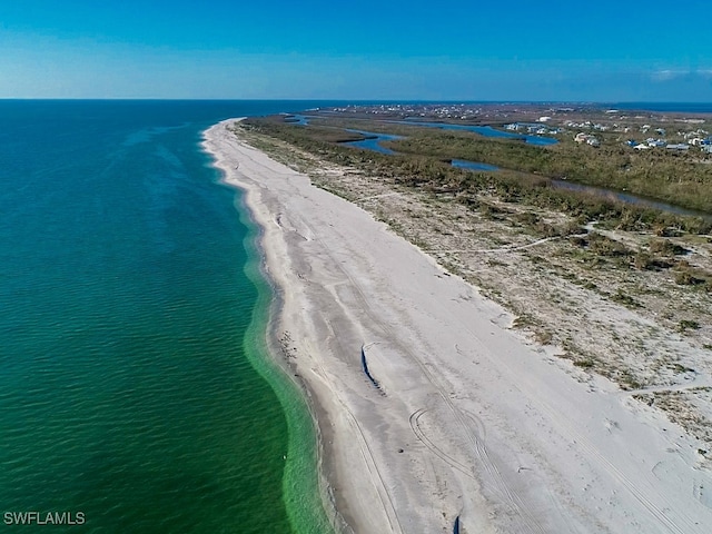 aerial view with a water view and a view of the beach