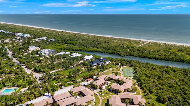 drone / aerial view with a water view and a view of the beach