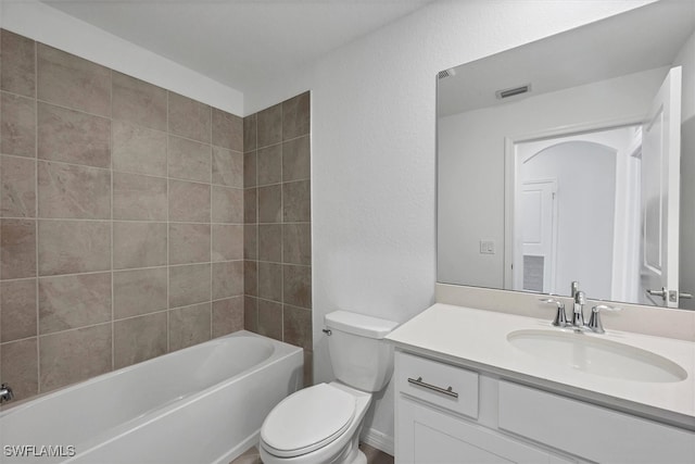 full bathroom with vanity, toilet, and tiled shower / bath