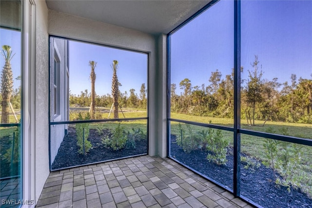 unfurnished sunroom featuring a wealth of natural light