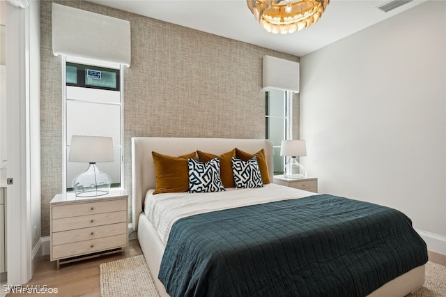 bedroom with wood-type flooring