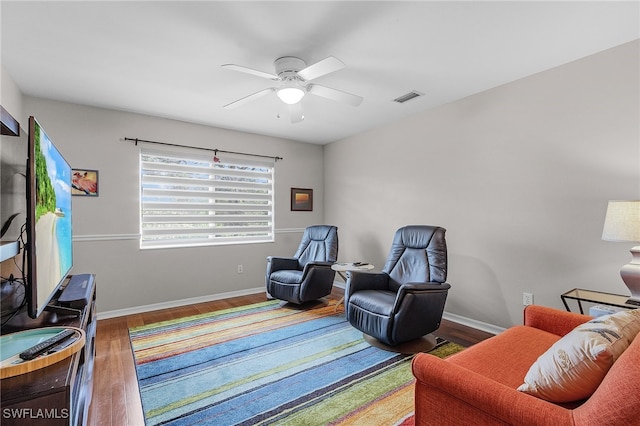 sitting room featuring hardwood / wood-style flooring and ceiling fan