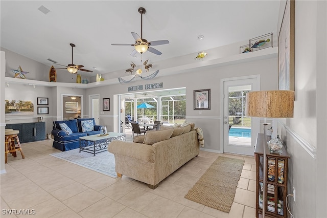 living room featuring ceiling fan, light tile patterned floors, and high vaulted ceiling