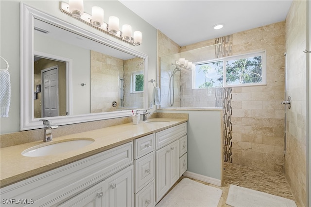 bathroom featuring vanity and a tile shower