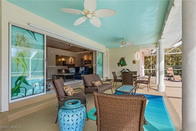 sunroom featuring ceiling fan