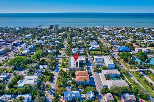 birds eye view of property featuring a residential view and a water view