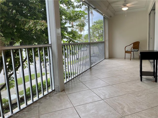 sunroom featuring ceiling fan