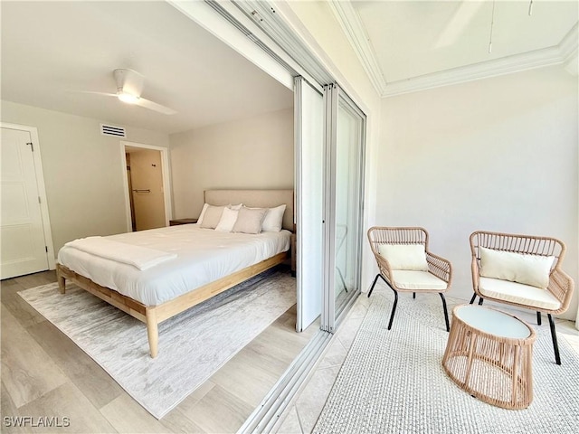 1051 3rd St S Unit 201, Naples, FL 34102 - bedroom with crown molding and ceiling fan