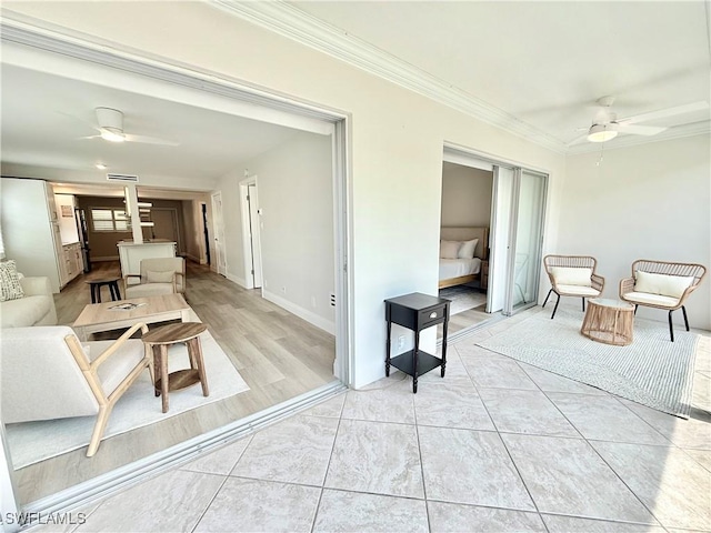 1051 3rd St S Unit 201, Naples, FL 34102 - living area featuring ceiling fan, ornamental molding, and baseboards