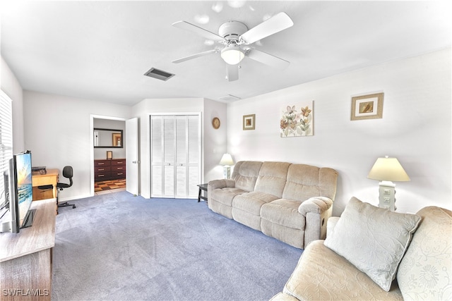 living room with carpet flooring and ceiling fan