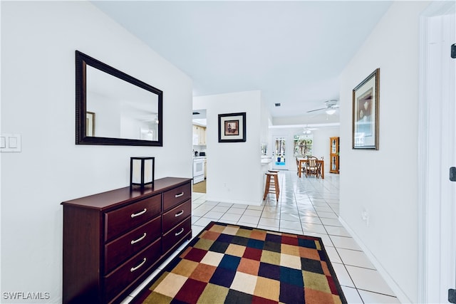 hall featuring light tile patterned floors