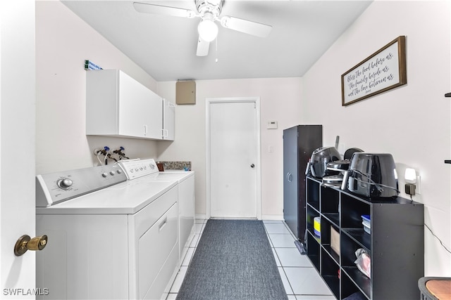 washroom with cabinets, independent washer and dryer, light tile patterned floors, and ceiling fan