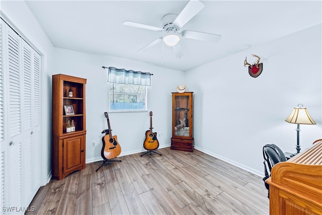 office area with light hardwood / wood-style flooring and ceiling fan