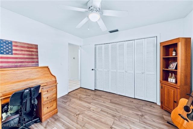 office area with ceiling fan and light hardwood / wood-style flooring