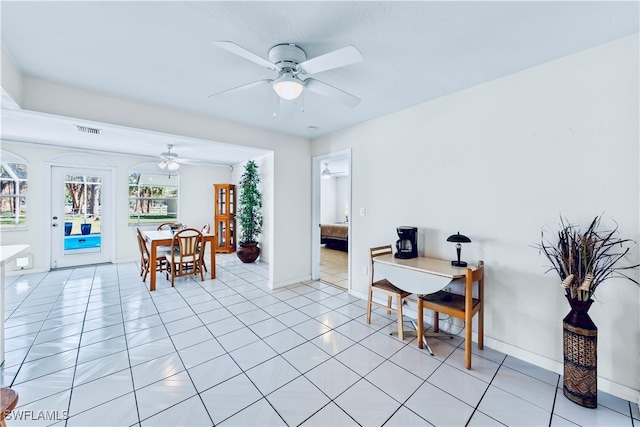 dining area with ceiling fan and light tile patterned floors