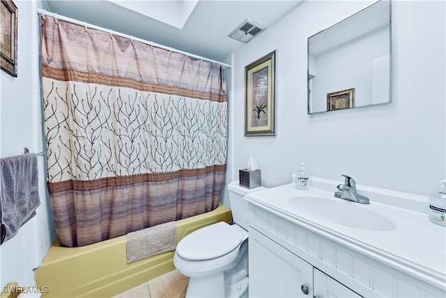 full bathroom featuring tile patterned floors, shower / bath combination with curtain, toilet, and vanity