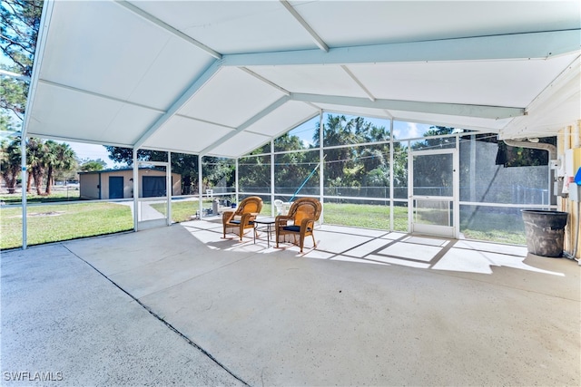 sunroom featuring lofted ceiling