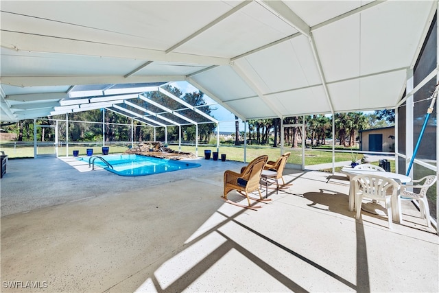 view of swimming pool featuring a lanai, a lawn, and a patio