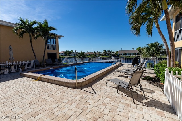 view of swimming pool featuring a patio