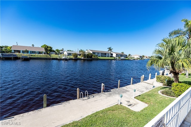 dock area featuring a yard and a water view