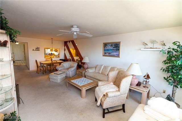 carpeted living room featuring a ceiling fan