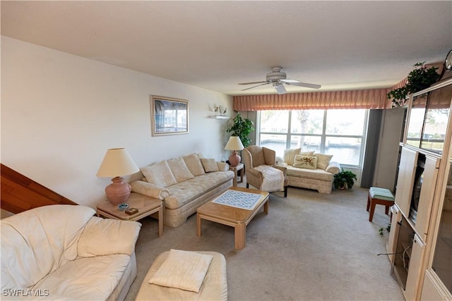 living room with light carpet and ceiling fan