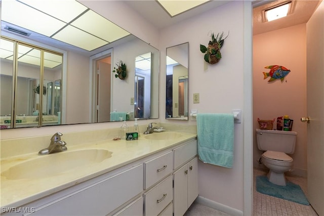 full bathroom featuring visible vents, a sink, toilet, and double vanity