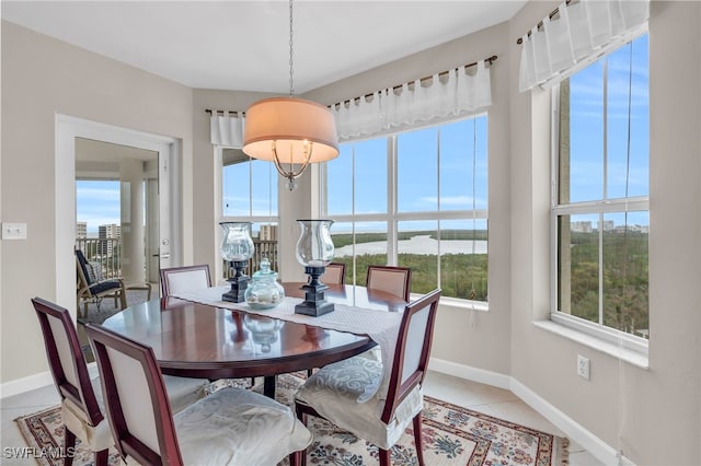 dining area with light tile patterned floors