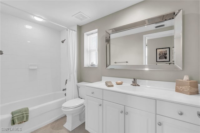 full bathroom featuring tile patterned flooring, vanity, toilet, and shower / tub combo