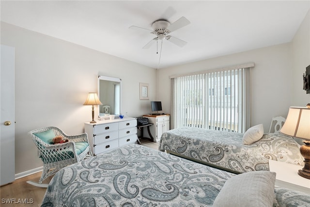 bedroom with ceiling fan and light hardwood / wood-style floors