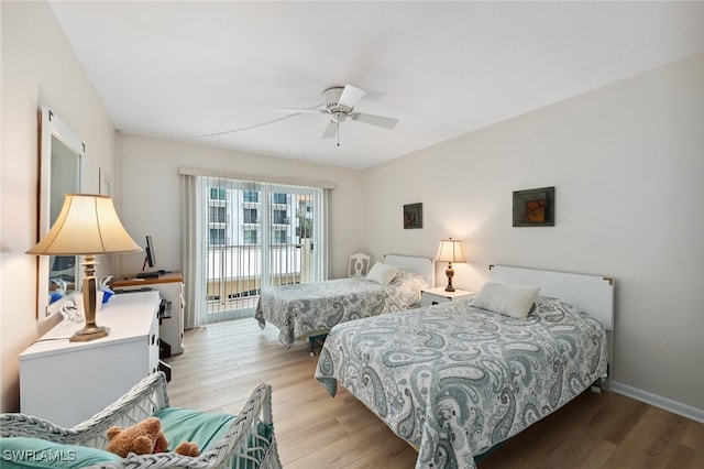 bedroom with light wood-type flooring, access to outside, and ceiling fan