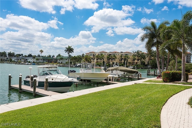 dock area with a water view and a yard