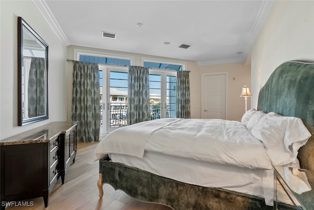 bedroom featuring access to exterior, crown molding, and light hardwood / wood-style flooring