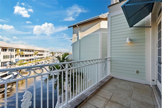 balcony featuring a water view