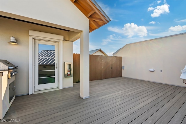 wooden terrace featuring area for grilling