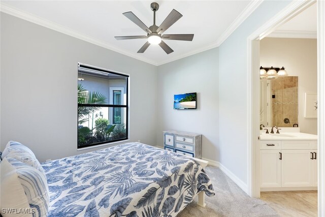 bedroom with connected bathroom, ceiling fan, sink, and ornamental molding